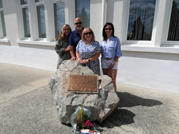 The CHIAPETTO family in front of the plaque given by the Americans to the inhabitants of the Indre department